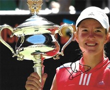 justine henin holds the trophy after win on hard court signed 10x8 photo