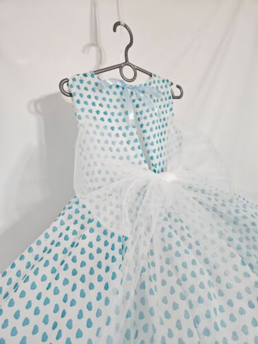 A lush, elegant dress for a ball in the style of the 60s. Fluffy skirt. for a gi