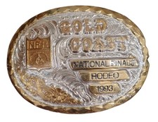 NEW IN BOX 1993 Gold Coast National Finals Rodeo gold and silver belt buckle.