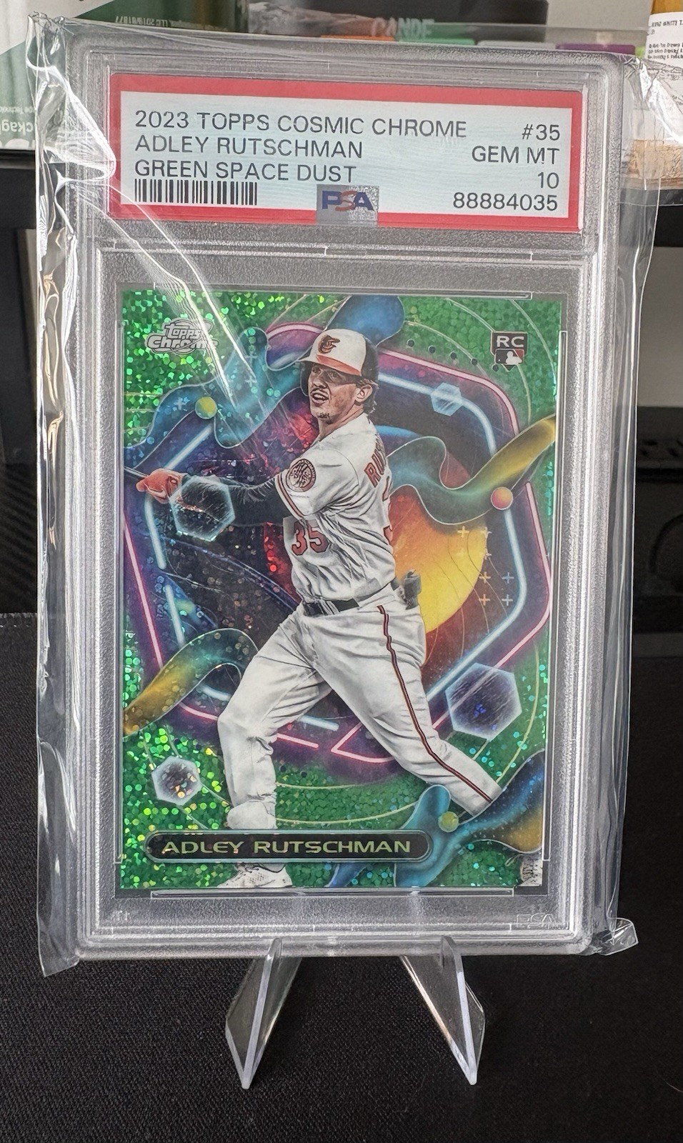 2023 Topps Cosmic Chrome Adley Rutschman Green Space Dust /75 PSA 10