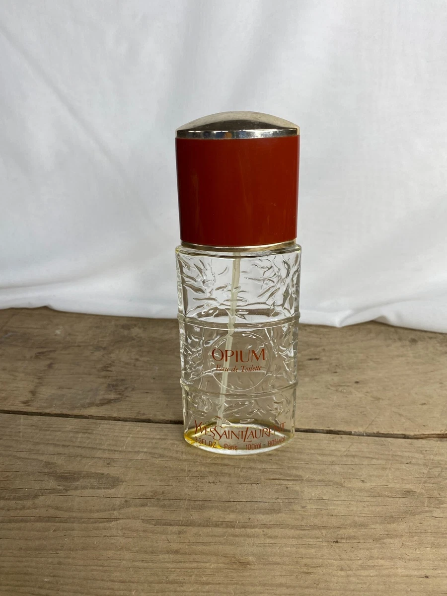 Opium top perfume bottle