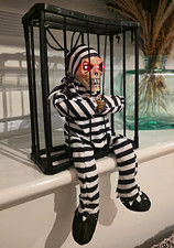 Motion Detected/ Talking Light-Up Halloween Skeleton Prisoner Figurine in Cage