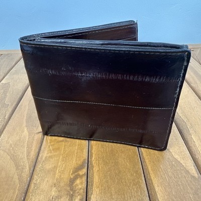 This is a vintage Lee Sands genuine eel skin bifold wallet in a deep brown color