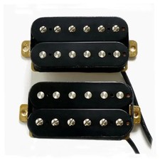 60s vintage-style black Alnico 5 humbucker guitar pickup with white cover.