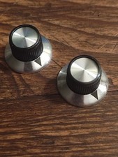 For guitar or bass, 2 retro radio knobs, big aluminum knobs.