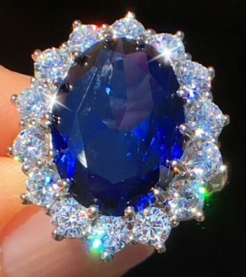 12.55 CT Oval Shape Blue Sapphire & Round Cut CZ Halo Wedding Ring In 925 Silver