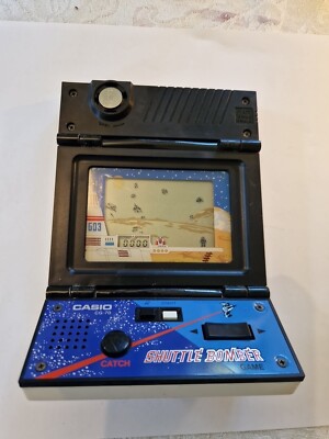 Casio 1983 CG-70 Shuttle Bomber Electronic Handheld Video LCD Game