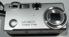 Minolta DiMAGE F100 4MP Compact Digital Camera–Silver - Battery Door Won't Lock