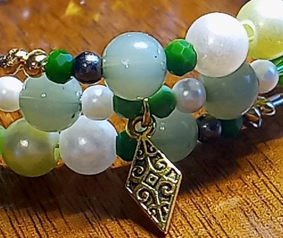 ''Faith'' is a handmade wire wrap bracelet. 			
