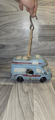 decorative birdhouse designed to look like a retro RV camper van