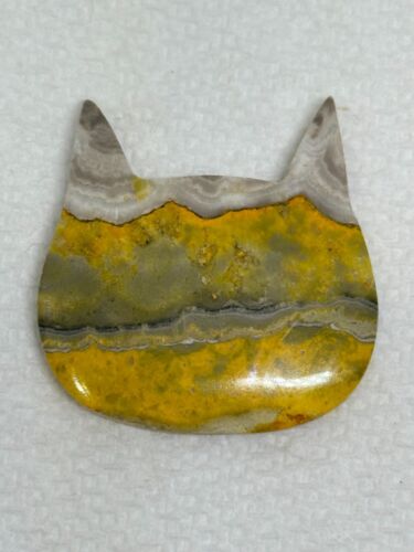 Bumblebee Jasper carved cat head silhouette, 55.06 carats