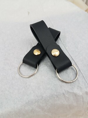 Black leather keychain with solid brass rivet.  (One)