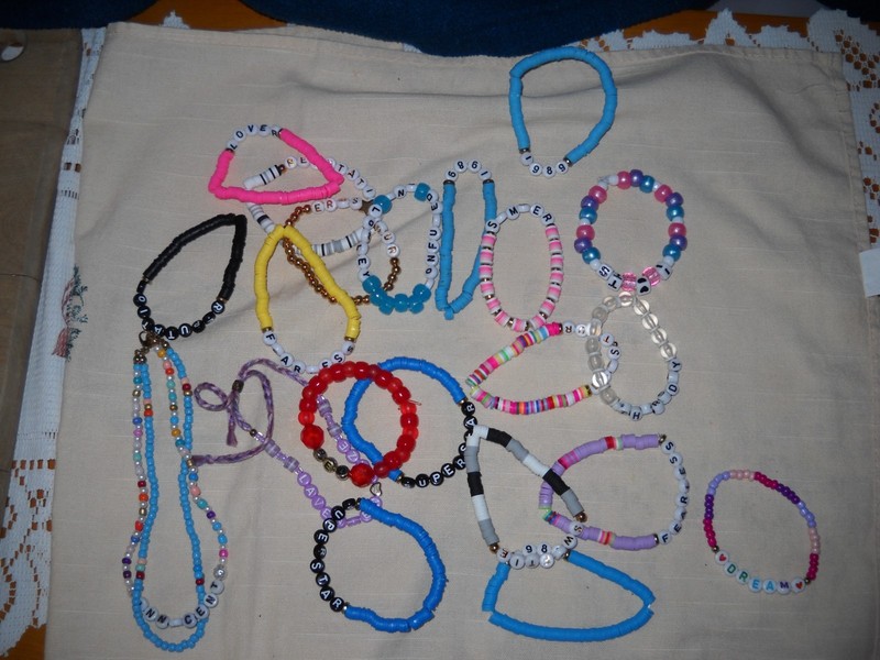 Huge Lot of Taylor Swift Themed Merchandise: Bracelets, croc pins, stickers More
