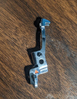 Needle guard from White Superlock 534 Serger Original Part