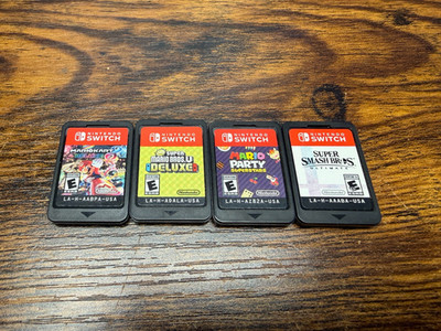 4 Nintendo switch games, Mario Party, Smash Bros Ultimate, Mario Kart 8, Deluxe