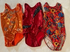 Lot Of 3 GK  Elite  Gymnastics Leotards Child Small Medium Red Shawn Orange