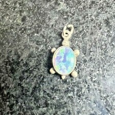 Sterling Silver Turtle Pendant with Multiple Blue Colored Stone 101GRW