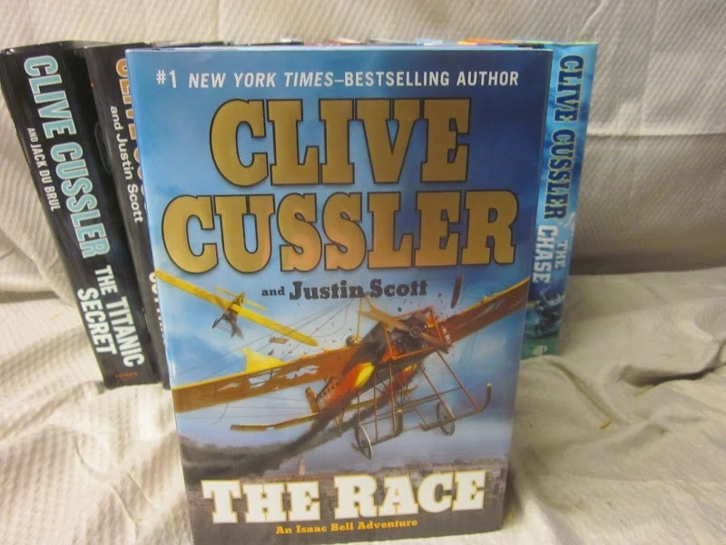 Lot of 12 Clive Cussler Novels Hardcover Books - Isaac Bell Series - Image 2 of 4