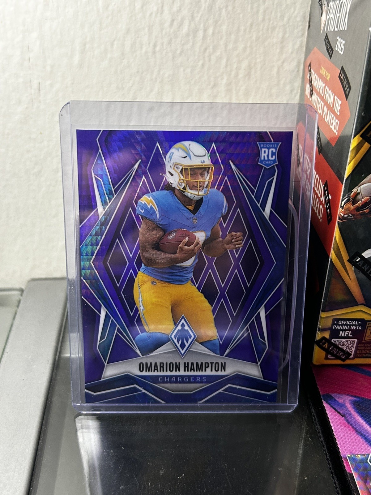 2025 Panini Phoenix - Rookies Omarion Hampton #192 Purple Winter /249 (RC)