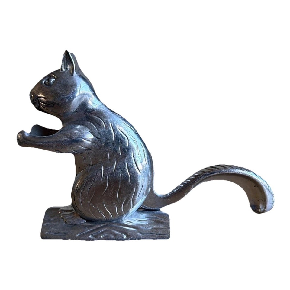 A chunky, characterful vintage aluminum squirrel-on-a-log nutcracker that's equal parts functional and shelf-worthy sculpture.