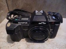Olympus OM77AF 35mm Film SLR Camera BODY ONLY MISSING BATTERY COVER UNTESTED 