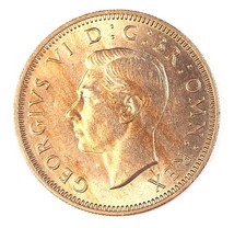 1950 George VI Scottish Shilling. In UNC condition with a  light toning.