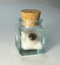 Antique prosthetic human glass eye in vintage apothecary jar. "specimen" #3