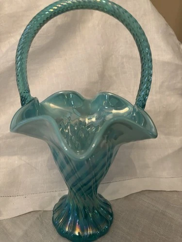 Vintage Fenton carnival glass bride's basket with iridescent blue-green finish.
