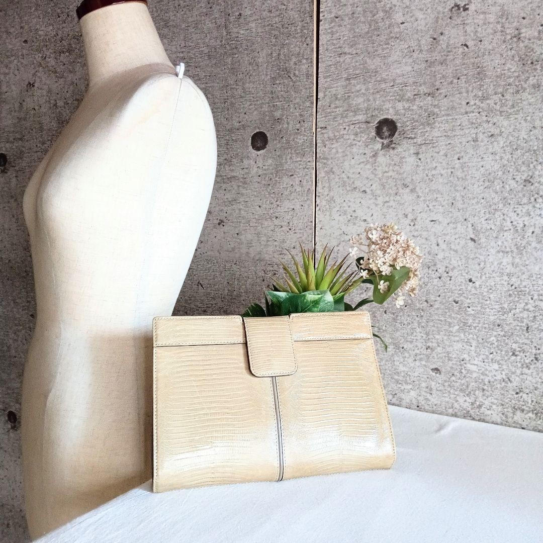 YVES SAINT LAURENT busta vintage YSL pochette borsetta pelle beige con sacchetto antipolvere