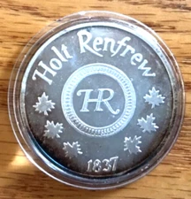 Monix Holt Renfrew 1975 redemption $25 bilingual token .999 silver 1 once 1197
