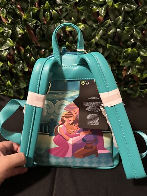 Loungefly Teal Castle rapunzel Mini Backpack Amazon.com: Loungefly Disney Tangled Princess Castle MINI  main image 2