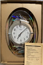 Small World Rhythm Magic Motion Wall Clock Dolphins Swimming Brand New In Box