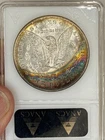 1885 Morgan dollar ANACS MS63 great rainbow crescent toning