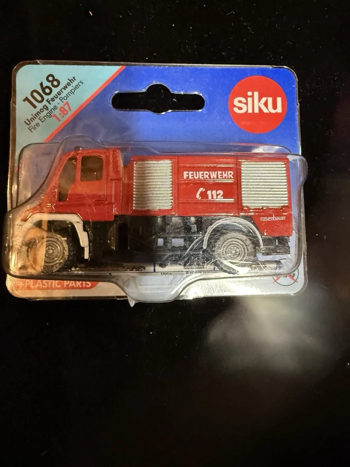Siku 1068 Mercedes Unimog Rosenbauer Fire Engine - Bomberos 1/87 HO Die-cast Foto 2 de 4