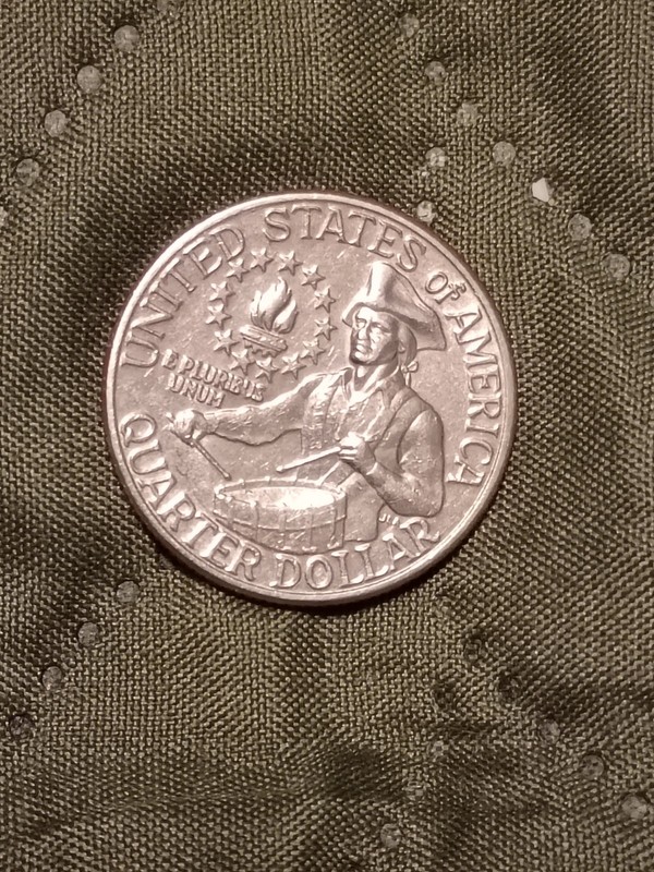 1776-1976 D US Bicentennial Quarter features a rare filled Mint Mark 
