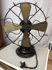 1925 Polar Cub fan.  Brass blades, works well.