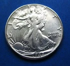1942 LIBERTY WALKING SILVER HALF DOLLAR, AU/BU CONDITION.