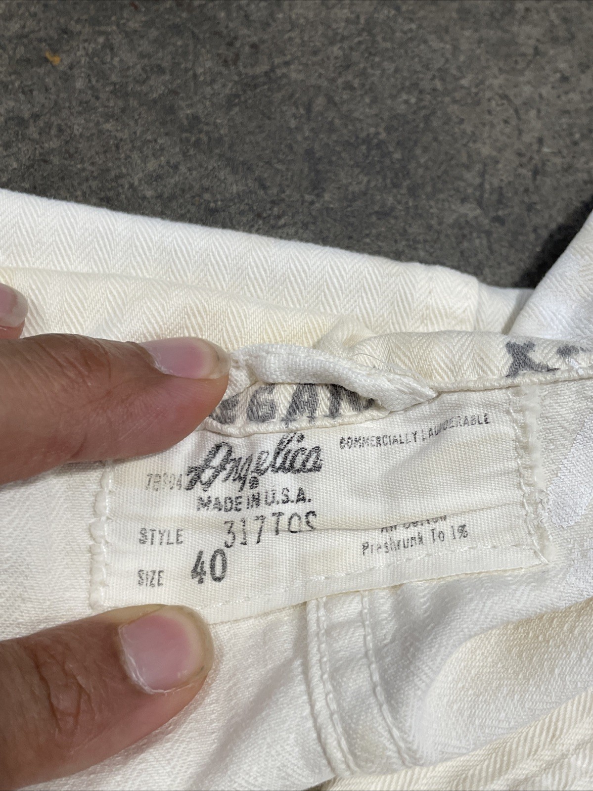 White vintage painters smock work wear with size 40 tag, brown seam, and “Angelica Made in U.S.A.” label.