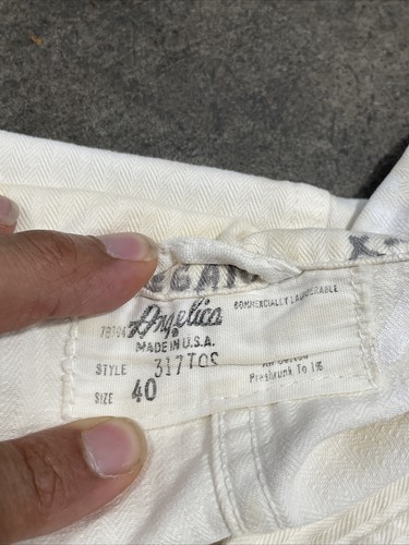 White vintage painters smock work wear with size 40 tag, brown seam, and “Angelica Made in U.S.A.” label.
