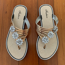 Fashion rhinestone gold flip flops with silver floral embellishments, size 7, 38