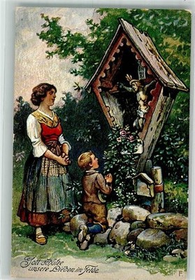 39898416 - Mother and child praying WW I God protect our loved ones in the field