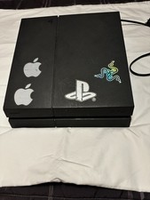 Sony PlayStation 4 500 GB Black with controller and head set.