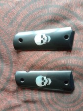 1911 pistol grips,new in original packing.ebony hardwood with mother of pearl sk