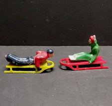 Vintage Barclay Manoil Lead Figurines Man  Woman On Sleds Winter 3"