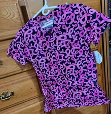 NWT - XXS WHITE CROSS SCRUB TOP  STYLE: RIBBONS MAKE IT HAPPEN