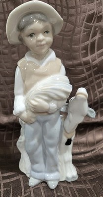 Porcelain Figurine Of BOY WITH HAY AND HIS COW