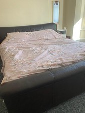Super king brown leather bed (dismantled) and mattress. Some slight scuff marks