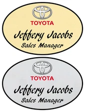 1 GOLD & 1 SILVER OVAL TOYOTA PERSONALIZED NAME BADGES W/ SAFETY PIN FASTENER