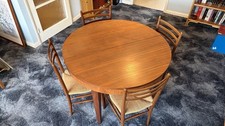 Mid-century (1967) extendable Dining Table And SIX G wicker Chairs