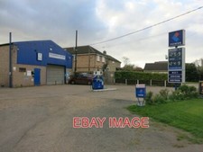 PHOTO  TEVERSHAM MOTORS OLD FASHIONED VILLAGE GARAGE AND PETROL PUMPS. 2015